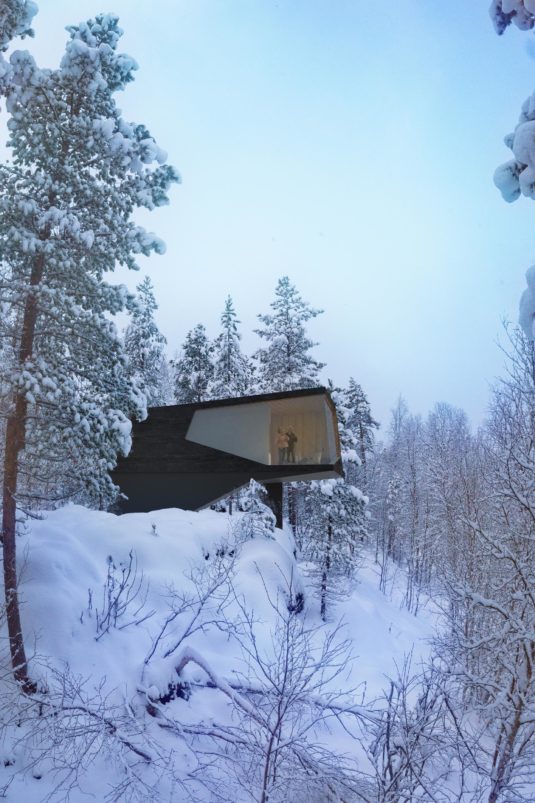 A house leaning over a slope during winter.